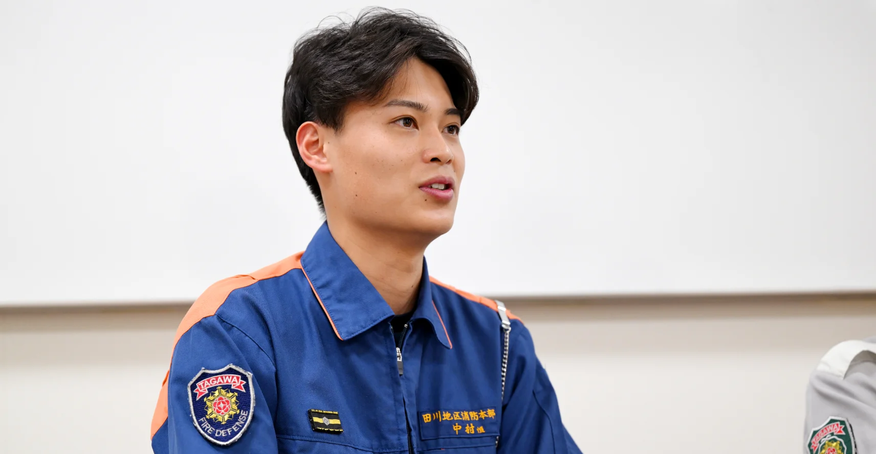 中村さんがインタビューに答える様子